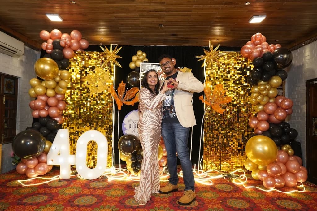 40th birthday gold shimmer backdrop with marquee light numbers